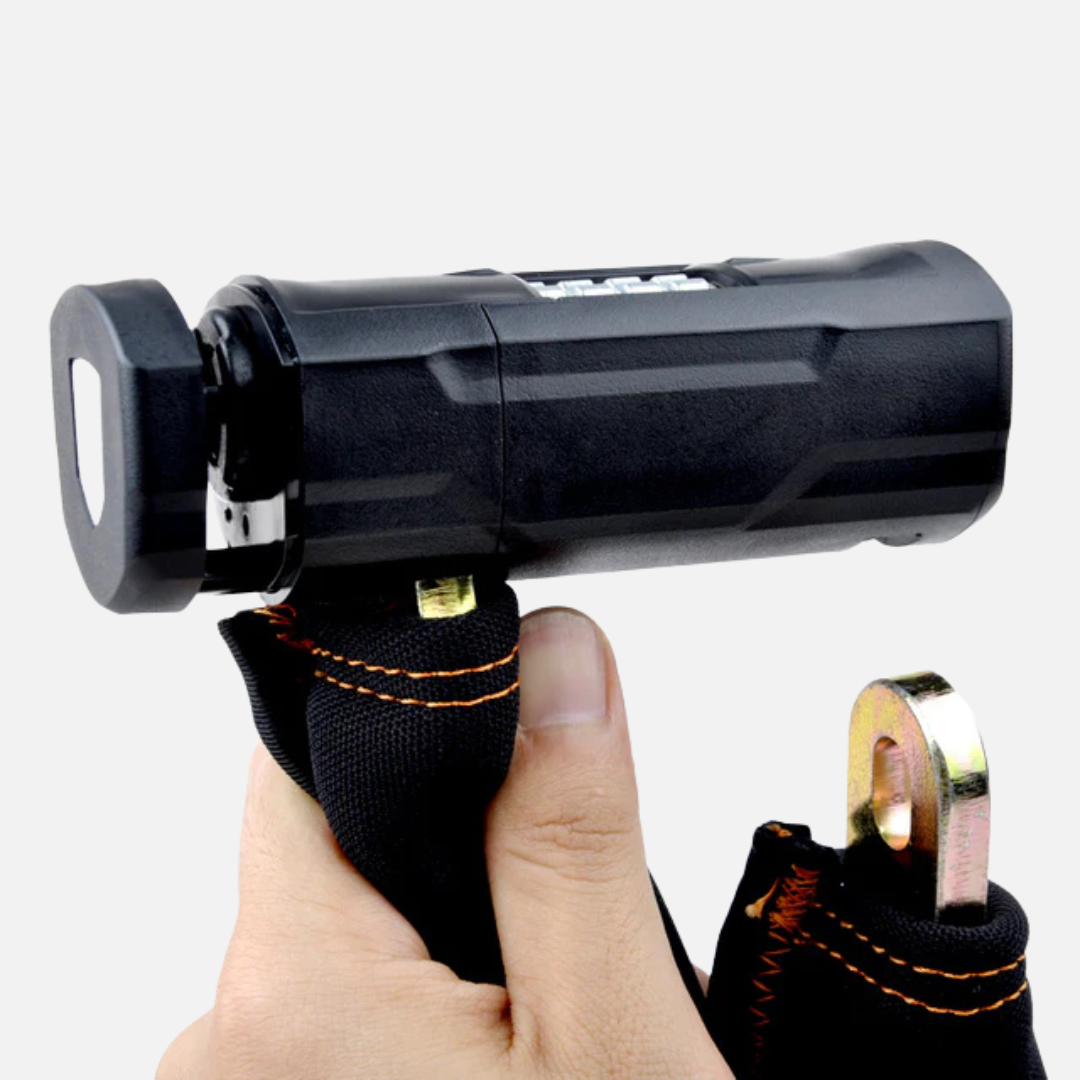 Hand inserting the hardened steel hook into the ETOOK Titan Ultra chain lock's combination cylinder to secure it