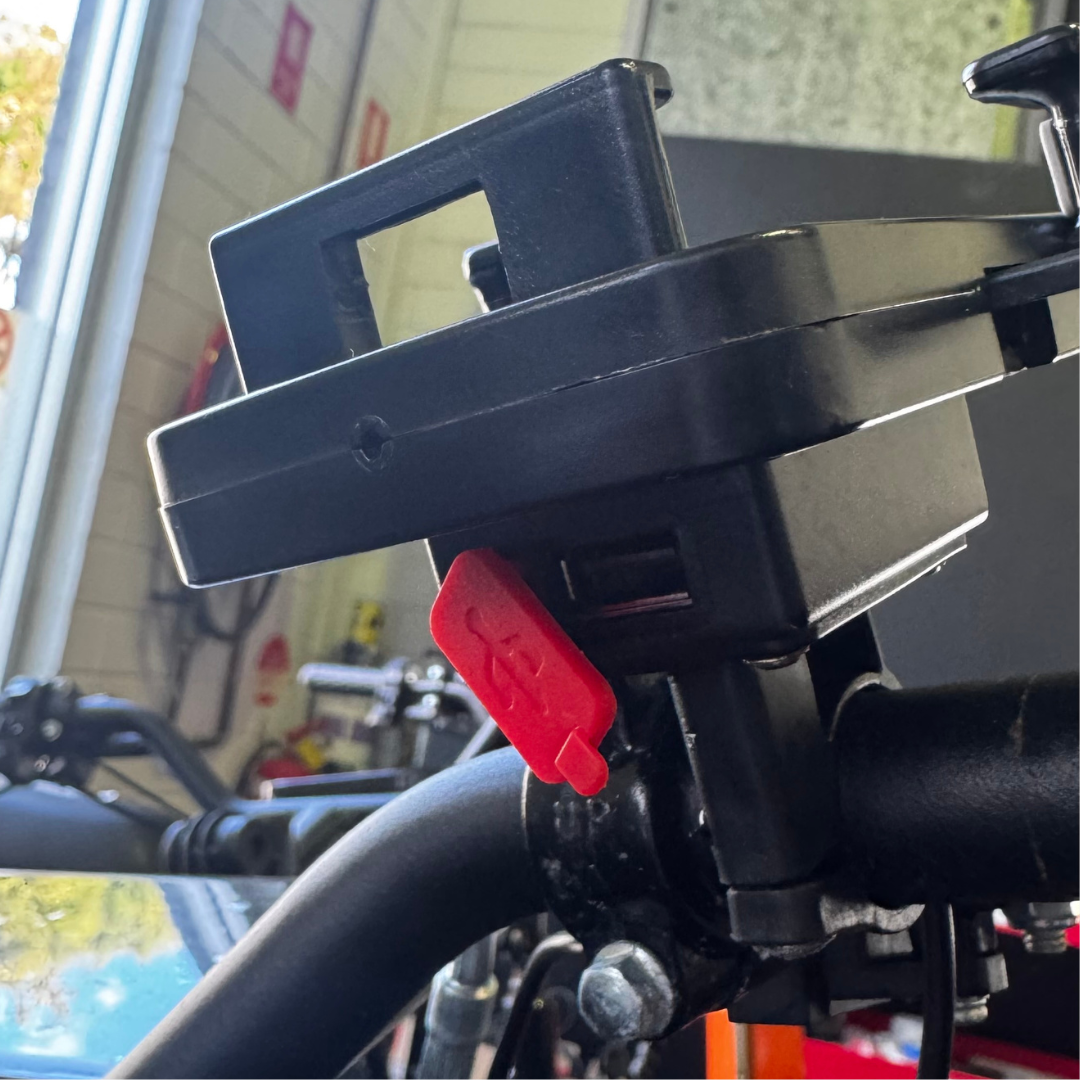 Close-up of the USB-A charging port on the E-Bike Phone Holder — Cool Bikes Sydney workshop