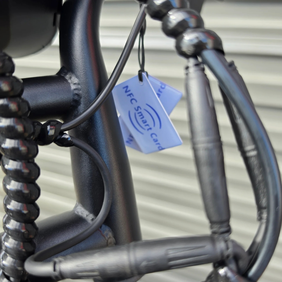 OUXI V8 Ultra electric bike - close-up of NFC smart card unlock accessory