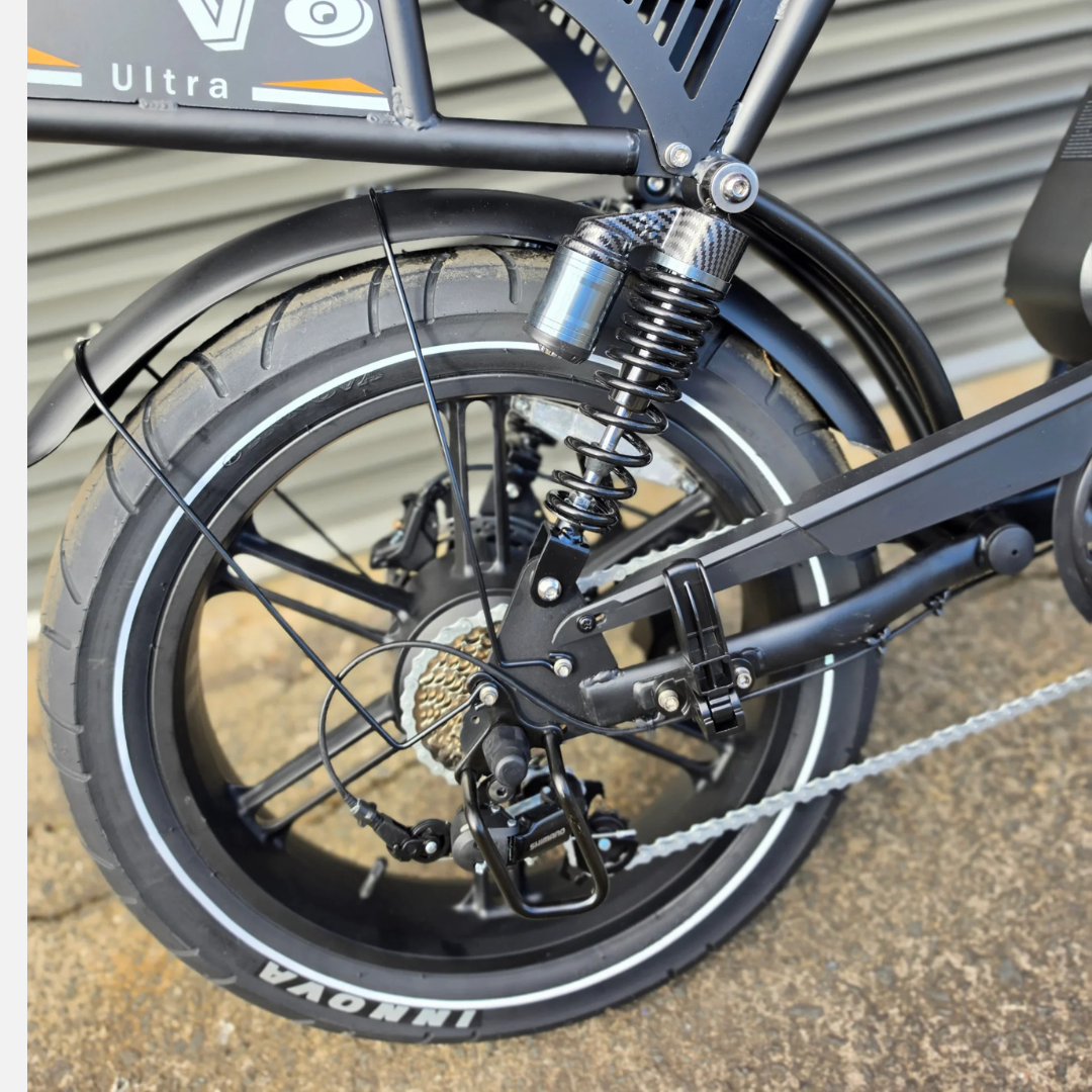 OUXI V8 Ultra electric bike - close-up of rear wheel, suspension and Shimano cassette